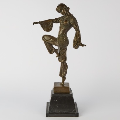 A Metal Statue in the Style of Demetre Chiparus