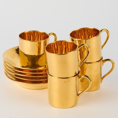 A Set of Five Maison Delvaux Demitasse Cups and Saucers