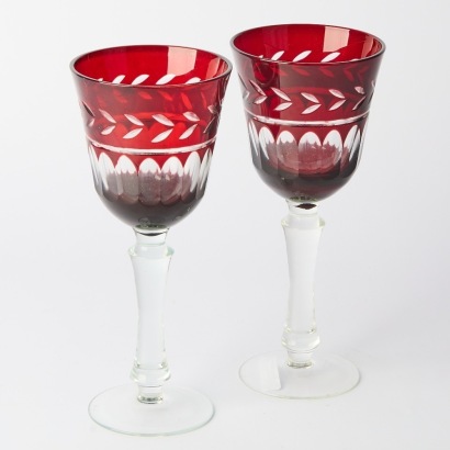 A pair of ruby cut to clear wine goblets
