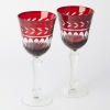 A pair of ruby cut to clear wine goblets