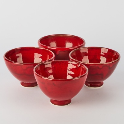 A Set of Four Sang de Boeuf Glazed Rice Bowls by Shim & Lee
