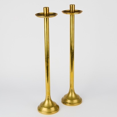 A Pair of Tall Brass Candlesticks