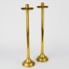 A Pair of Tall Brass Candlesticks