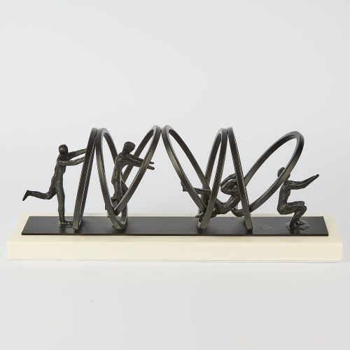 A Metal Sculpture Jumping Through Hoops