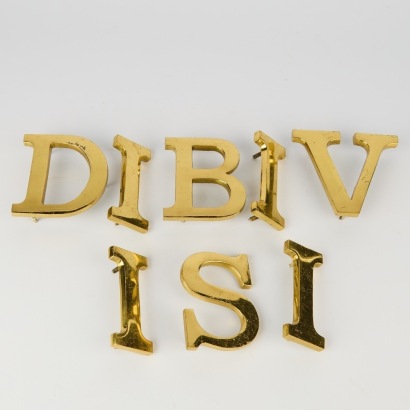 A Set of Eight Vintage Solid Brass Letters