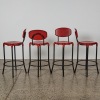 A Set of Four Red Sebel Cosmic Barstools