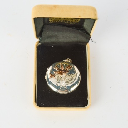 A Sterling Silver and Rose Gold Locket