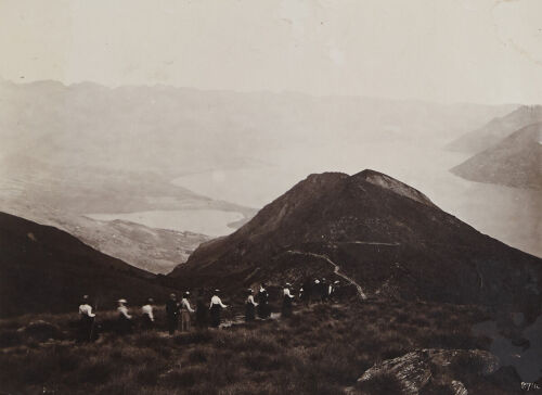 UNKNOWN PHOTOGRAPHER, Figures walking along a mountain path