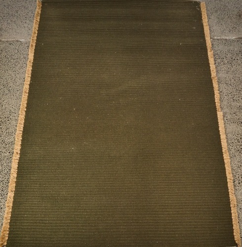A Handwoven Nodi Tasseled Wool Rug