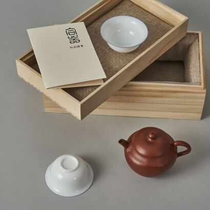 A Chinese Red Clay Teapot (Wu Fang Qin Zhi Mark) and Two White Glazed Tea Cups