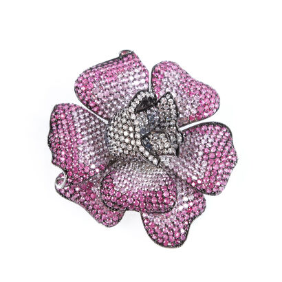 A Contemporary Pink Sapphire and Diamond Flower Brooch