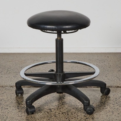 An Adjustable Swivel Salon Stool