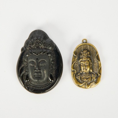 A Set of Two Guanyin Head Pendants in Dark Jade and Bronze