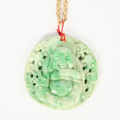 A Chinese Carved Jadeite Buddha Pendant