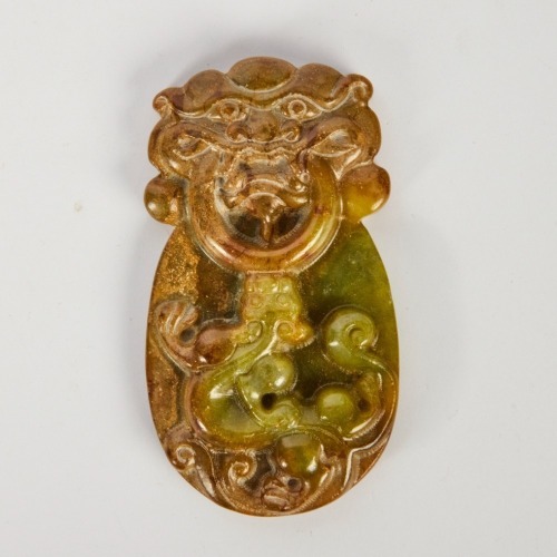 A Chinese Carved Jade Plaque with a Chi Dragon