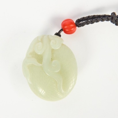 A Chinese Carved Green Jade Pendant