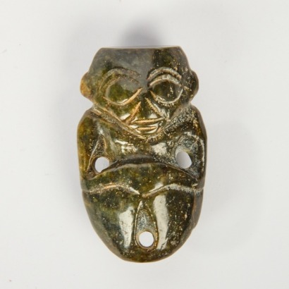 A Chinese Carved Jade Mask Pendant