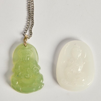 A Set of Two Carved Jade Guanyin Pendants