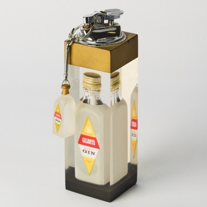 A Vintage Gilbey's Lighter and Keychain