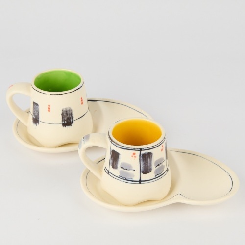 A Pair of B. Adams Kidney-Shaped Plates and Coffee Cups