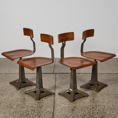 A Set of Four Vintage Industrial Singer Factory Chairs