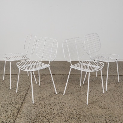 A Set of White Metal Dining Chairs