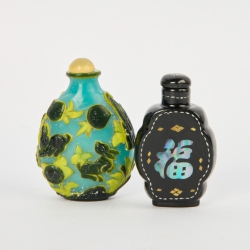 A 20 Century Chinese Overlay Glass Snuff Bottle and a Black Lacquer Mother of Pearl Inlaid Snuff Bottle