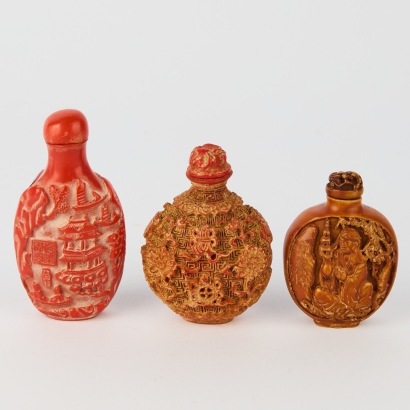 A Group of Three Chinese 20th Century Carved Red Resin Snuff Bottles