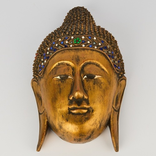 An Asian Carved Wood Buddha Head
