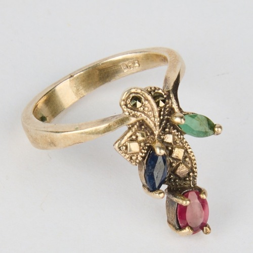 A Stg. Silver Ring with Emerald, Ruby & Blue Sapphire