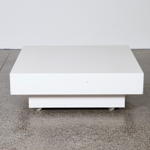 A Raised White Platform Plinth with Wheels