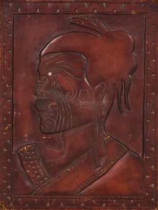 A Carved Panel with Maori Face