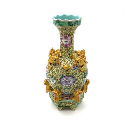 A Chinese Famille Rose 'Floral' Vase with twin dragon relief (Da Qing Qianlong Nian Zhi Mark)