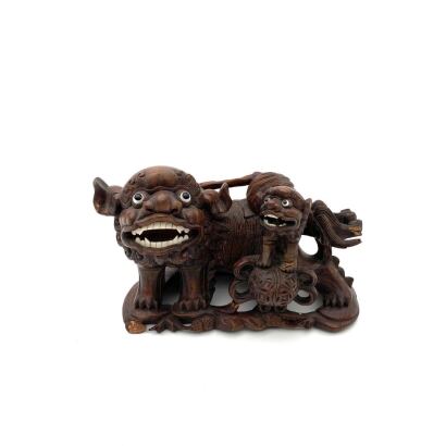 A Chinese Late Qing Dynasty Wood Carving of Lions