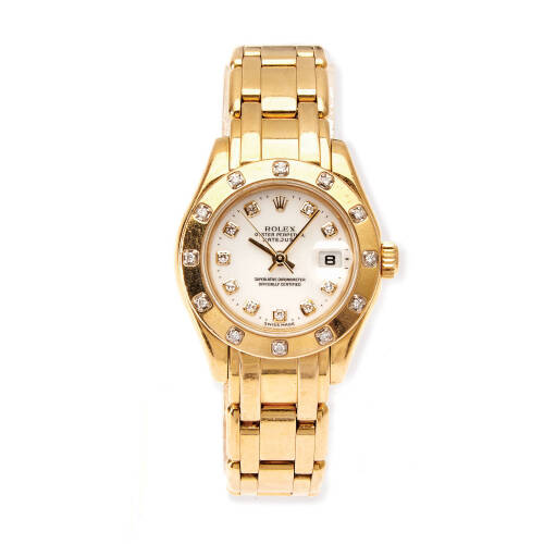 A Lady's gold Oyster Perpetual Datejust Pearlmaster wristwatch, Rolex, circa 1995. Automatic. 29mm. Ref: 80318. Serial number W084533. White dial with diamond markers. Diamond set bezel. Case, dial and original Pearlmaster bracelet signed. Original box, p