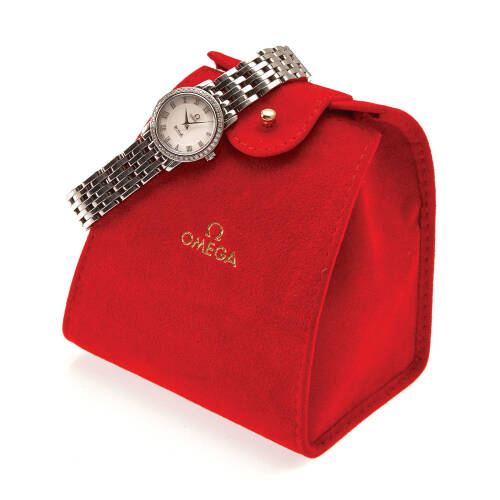 A Lady's stainless steel De Ville wristwatch, Omega. Quartz. 22mm. Ref. 4575.71.00. Cal. 1456. Serial number 90681722. Mother of pearl dial with applied silver Roman numerals. Diamond bezel. Case, dial and bracelet signed. Pouch and extra links.