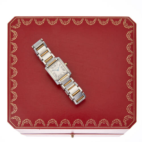 A Lady's stainless steel and gold Tank Francaise wristwatch, Cartier, circa mid 2000's. Quartz. 20mm. Ref: 2384. Serial number 318091CD. Silvered dial with roman numerals. Case, dial and bracelet signed.