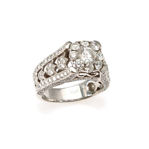 An ornate diamond cluster ring, bead set round brilliant cut diamond centre of estimated weight 0.71 carat, surrounded by one hundred and twenty-eight round brilliant cut diamonds of estimated total weight 2.07 carats. 18ct white gold. Weight 8.8 grams. 
