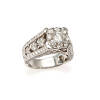 An ornate diamond cluster ring, bead set round brilliant cut diamond centre of estimated weight 0.71 carat, surrounded by one hundred and twenty-eight round brilliant cut diamonds of estimated total weight 2.07 carats. 18ct white gold. Weight 8.8 grams. 