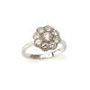A diamond floral style cluster ring, nine bead set round brilliant cut diamonds of estimated total weight 1.20 carats. 18ct white gold. Weight 3.8 grams. Ring size O. Gemologist's report available.
