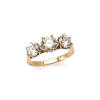 A three stone diamond ring, claw set round brilliant cut diamond centre of estimated weight 0.70 carat, set either side with round brilliant cut diamonds of estimated total weight 0.92 carats. 18ct yellow and white gold. Weight 3.7 grams. Ring size J. Gem