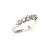A diamond band ring, five graduating claw set round brilliant cut diamonds of estimated total weight 0.59 carats. 18ct white gold. Weight 3.0 grams. Ring size M.