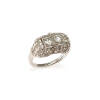 An Art Deco diamond ring, two claw set early round brilliant cut diamond centre stones of estimated total weight 0.50 carats, surrounded by seventy-four single cut diamonds of estimated total weight 0.60 carats in ornate pierced scroll setting. Platinum. 