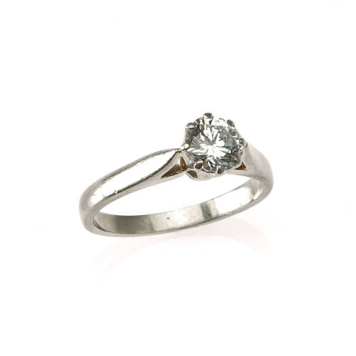 A diamond solitaire ring, claw set round brilliant cut diamond centre of estimated weight 0.62 carat. Platinum. Weight 3.6 grams. Size J. Gemologist's report available.