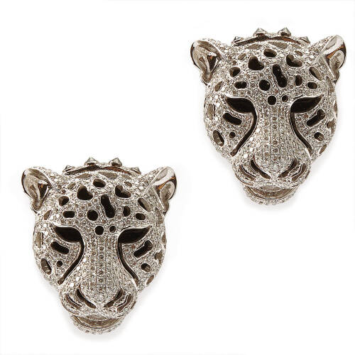 A pair of diamond and onyx leopard marks earrings, five hundred and seventy-two pave set round brilliant cut diamonds of estimated total weight 3.24 carats, in pierced out mask with onyx backing. 18ct white gold. Weight 20.5 grams. Length 25mm. Gemologist