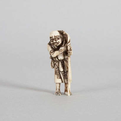 An Ivory Netsuke in the form of a Standing Figure