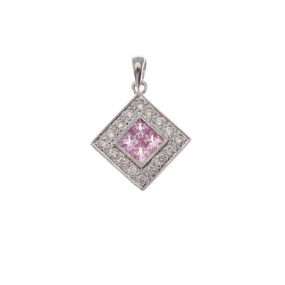 A square pink sapphire and diamond pendant, four illusion set square cut pink sapphires, surrounded by sixteen bead set round brilliant cut diamonds. 18ct white gold. 3.0 grams. Pendant 11 x 11mm.