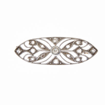 An Art Deco diamond brooch, fifteen diamonds set in pierced ornate plaque. 14ct white gold. Length 3.5cm.