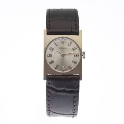 A Lady's 14ct white gold wristwatch, Le Coultre. Manual. 22.5mm. Square case with silver dial with double diamond markers. Dial and case signed. Non-original leather strap.