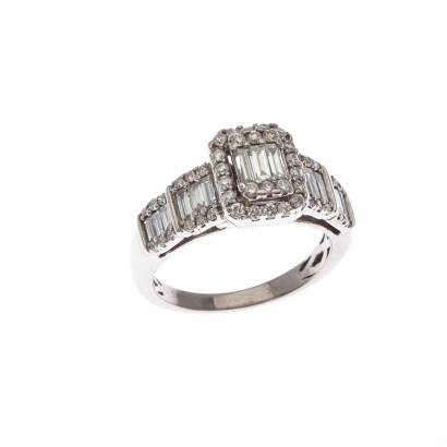 A diamond cluster ring, central raised row of fifteen claw set baguette cut diamonds of estimated total diamond weight 0.45 carats, surrounded by forty-eight claw set round brilliant cut diamonds of estimated total weight 0.55 carats. 14ct white gold. Wei